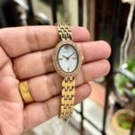 TORY BURCH THE OVAL GOLD TONE QUARTZ MOVEMENT - Image 2