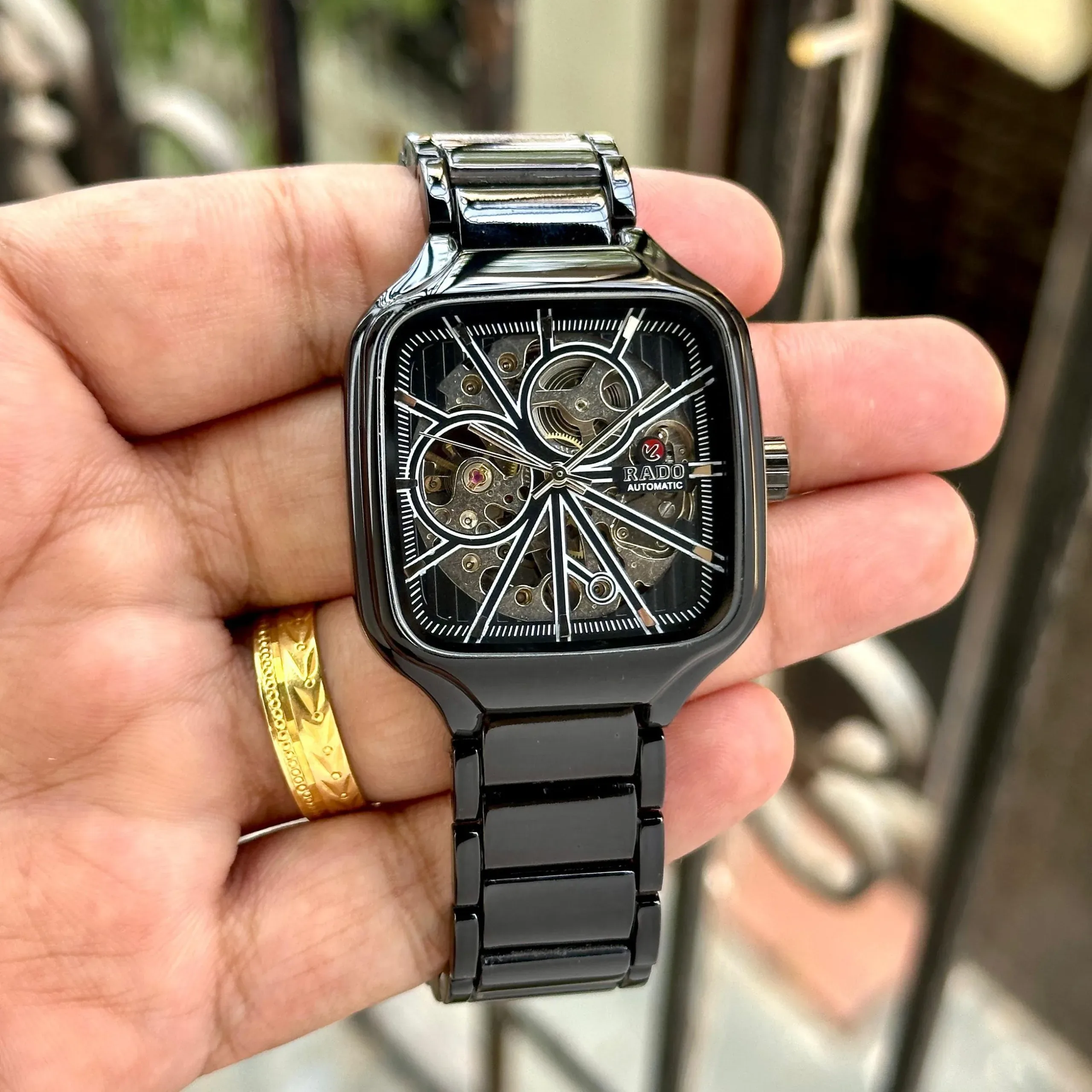 2025/11/IMG-20251113-WA0050-jpg.webp RADO TRUE SQUARE SKELETON OPEN HEART AUTOMATIC BLACK - Image 1