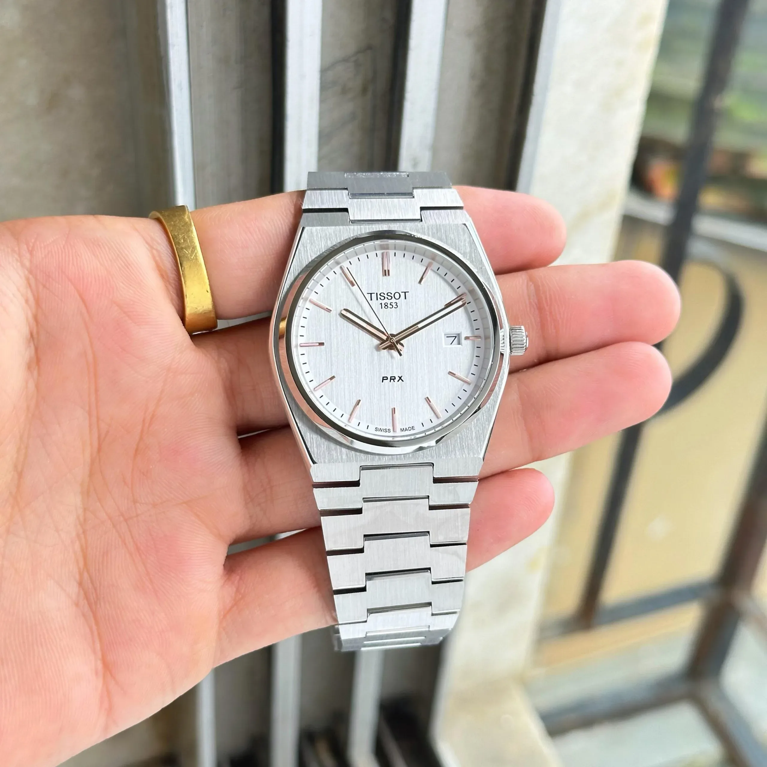 2025/11/IMG-20251117-WA0161-jpg.webp TISSOT PRX 7AA ULTRA PREMIUM STAINLESS STEEL WHITE DIAL - Image 1