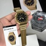 G SHOCK MONOCHROME STAINLESS STEEL GOLD BEZEL & BLACK DIAL